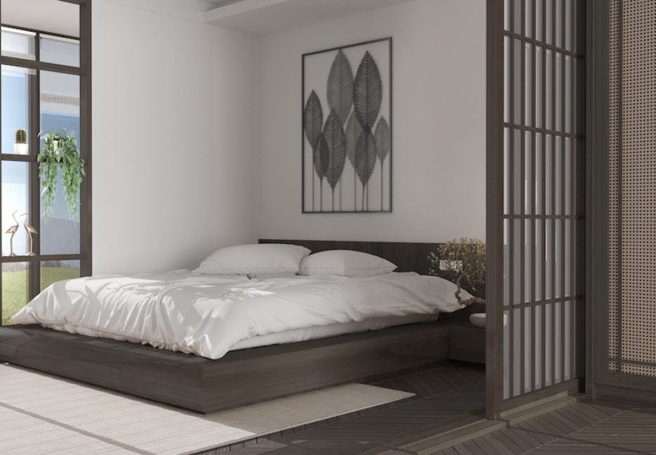 Minimalist bedroom in japanese style in white and dark tones, parquet floor, double wooden bed with pillows, sliding door, soft duvet, carpet and decors, modern interior design
